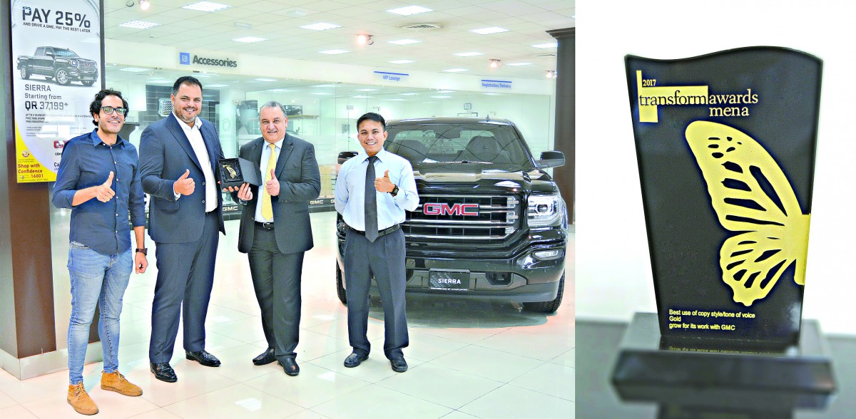 GMC and Grow Qatar officials with the gold award won during the Transform Awards MENA 2017.