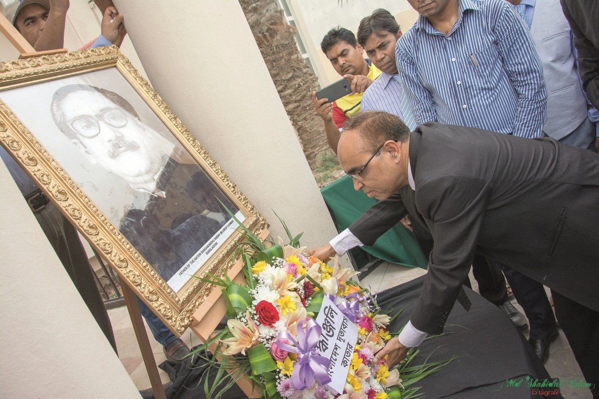 The Ambassador of Bangladesh, Ashud Ahmed, along with officials placing floral wreaths in front of the portrait of the Father of the Nation Bangabandhu Sheikh Mujibur Rahman, yesterday, at the embassy premise, yesterday. 