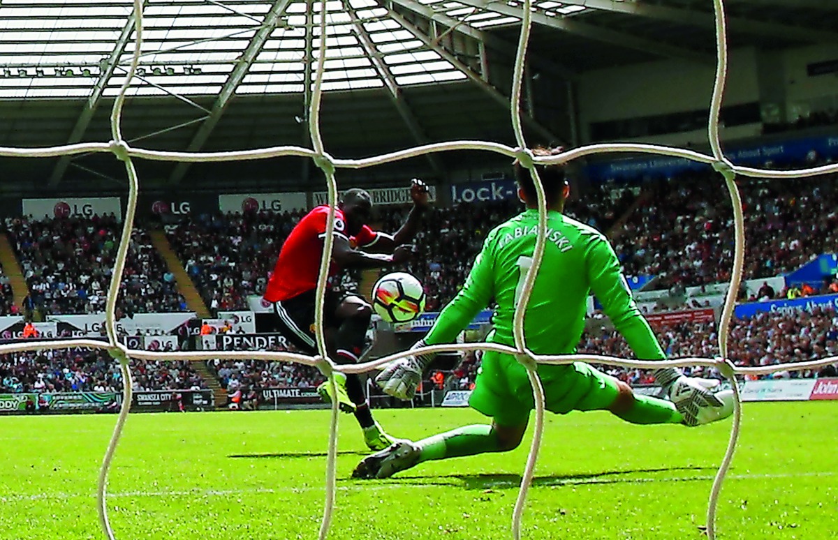 Manchester United’s Romelu Lukaku scores their second goal against Swansea City during their English Premier League match yesterday.
