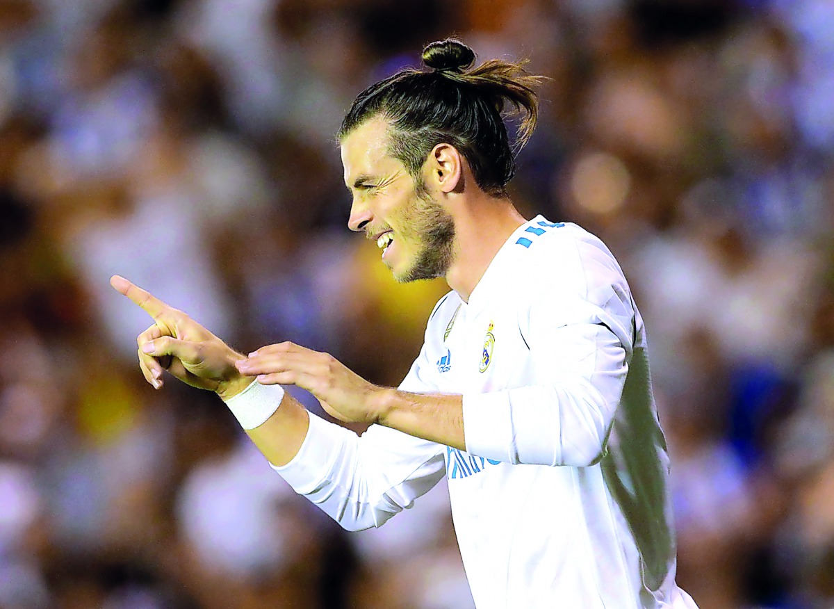 Real Madrid’s Gareth Bale celebrates after scoring their first goal against Deportivo de la Coruna in A Coruna, Spain on Sunday.