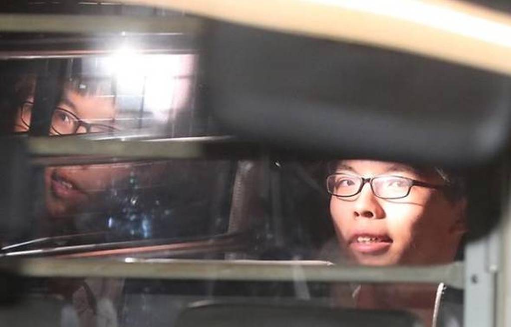 Student leader Joshua Wong leaves the High Court in a prison van after his sentencing on charges related to the 2014 pro-democracy Umbrella Movement, also known as Occupy Central protests, in Hong Kong, China August 17, 2017. Apple Daily/Tse Wing Yiu via 