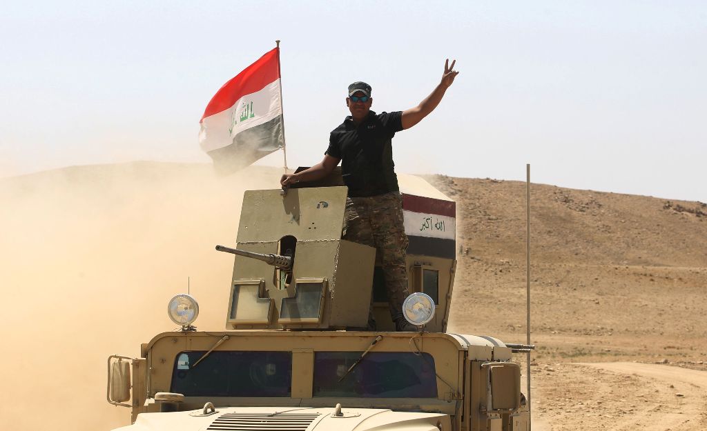 Iraqi forces, backed by Shiite fighters from the Popular Mobilization Forces, advance towards the towards the city of Tal Afar, the main remaining stronghold of the Islamic State group, after the government announced the beginning of an operation to retak