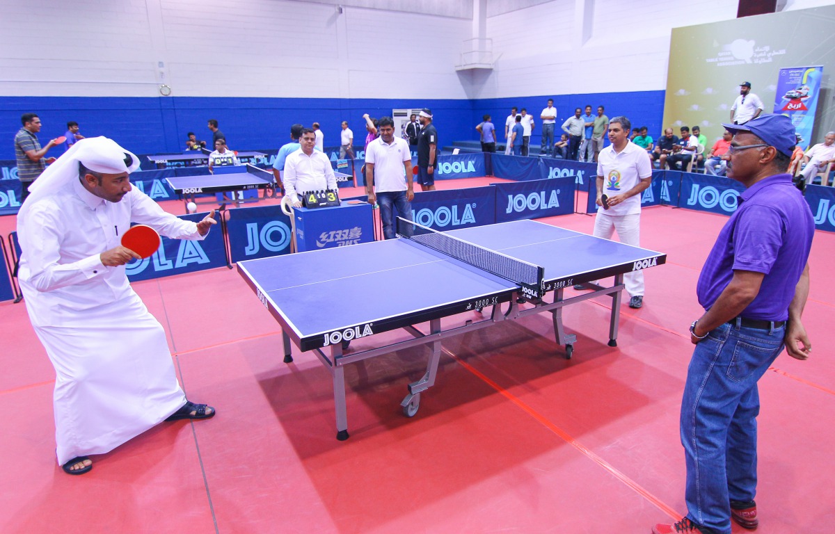 P Kumaran, Ambassador of India, and Thani Al Zarraa, QTTA Board Member, playing at the event.