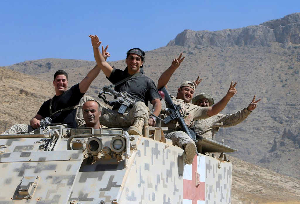FILE PHOTO: Lebanese army soldiers are seen flashing victory signs in the town of Ras Baalbek, Lebanon August 21, 2017. REUTERS/ Ali Hashisho/ File Photo
