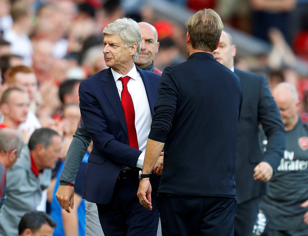 Arsenal manager Arsene Wenger shakes hands with Liverpool manager Juergen Klopp after the game REUTERS/Phil Noble 
