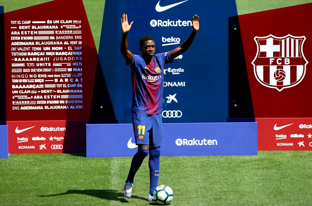 Barcelona's new signing Ousmane Dembele raises hands. REUTERS/Albert Gea