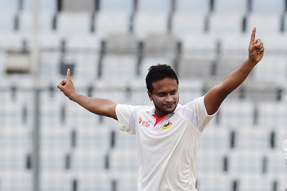 Bangladeshi cricketer Shakib Al Hasan reacts after the dismisal of Australian cricketer Matt Renshaw during the second day of the first Test cricket match between Bangladesh and Australia at the Sher-e-Bangla National Cricket Stadium in Dhaka on August 28