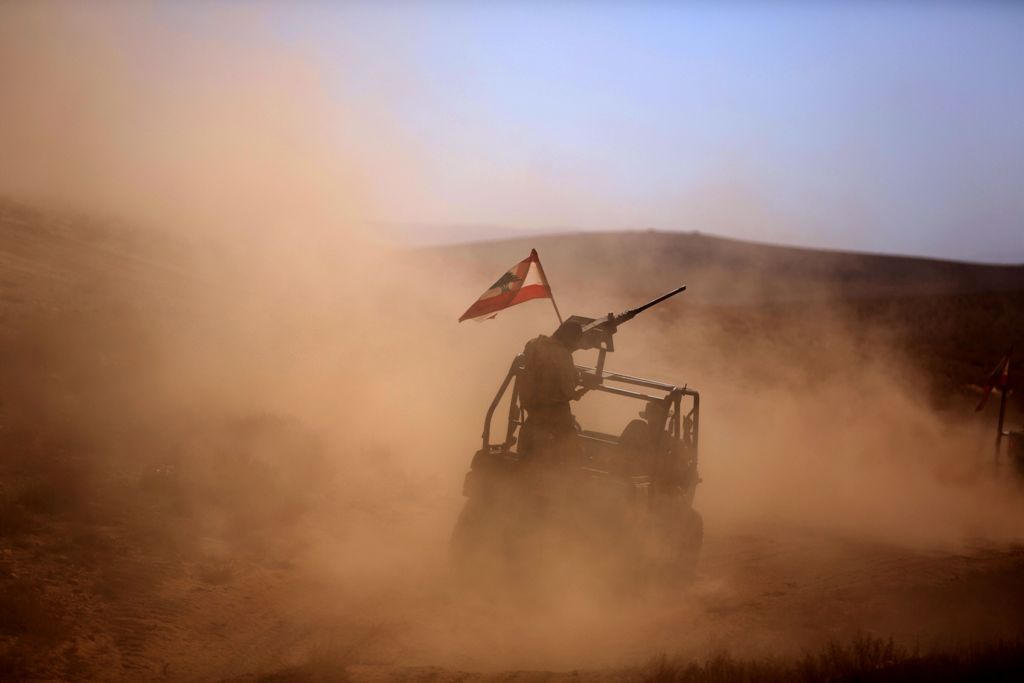 A picture taken on an army-organized press tour shows Lebanese army soldiers with the 6th Brigade driving a buggy bearing the Lebanese flag in an area they recently took from the Islamic State (IS) group in Jurud Ras Baalbek on the Syrian-Lebanese border 