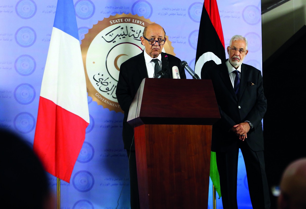 French Foreign Affairs Minister Jean-Yves Le Drian (left) with his Libyan counterpart Mohamed Taha Siala during a joint press conference  in Tripoli yesterday.
