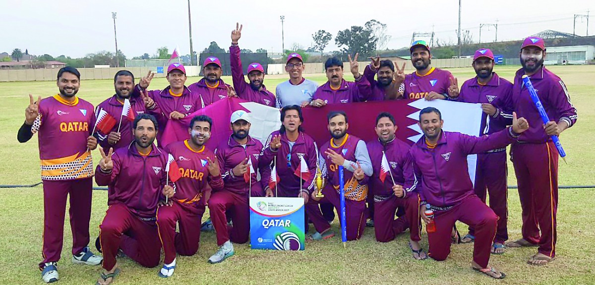 Jubilant Qatari players and officials pose for a photograph after winning the third place of the ICC World Cricket League  Division 5 Tournament in Benoni, South Africa yesterday.
