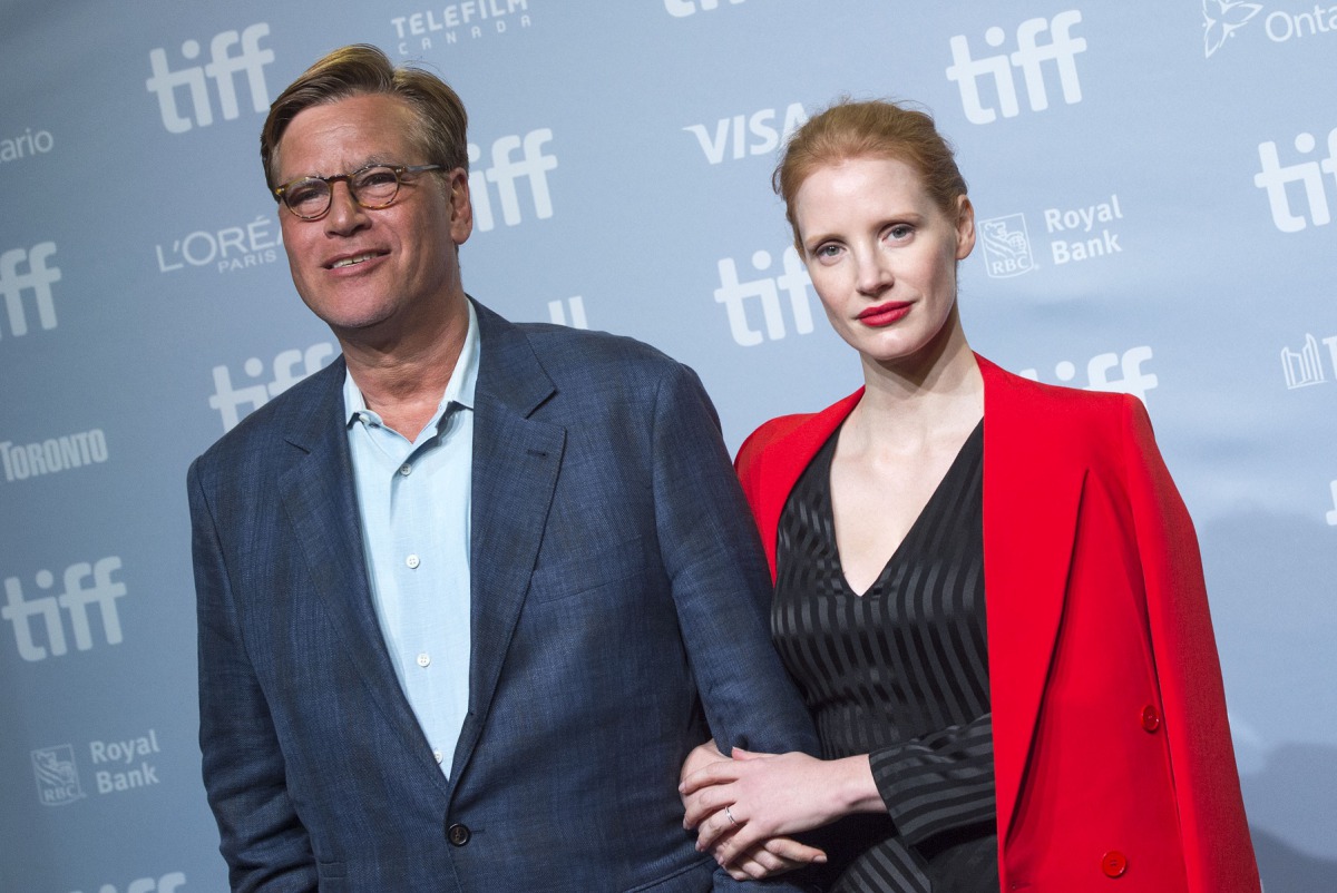 Writer/Director Aaron Sorkin (L) and actress Jessica Chastain attend the press conference for 