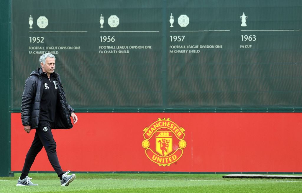(FILES) This file photo taken on May 19, 2017 shows Manchester United's Portuguese manager Jose Mourinho attends a team training session as part of a media open day at the club's training complex near Carrington, west of Manchester in north west England o