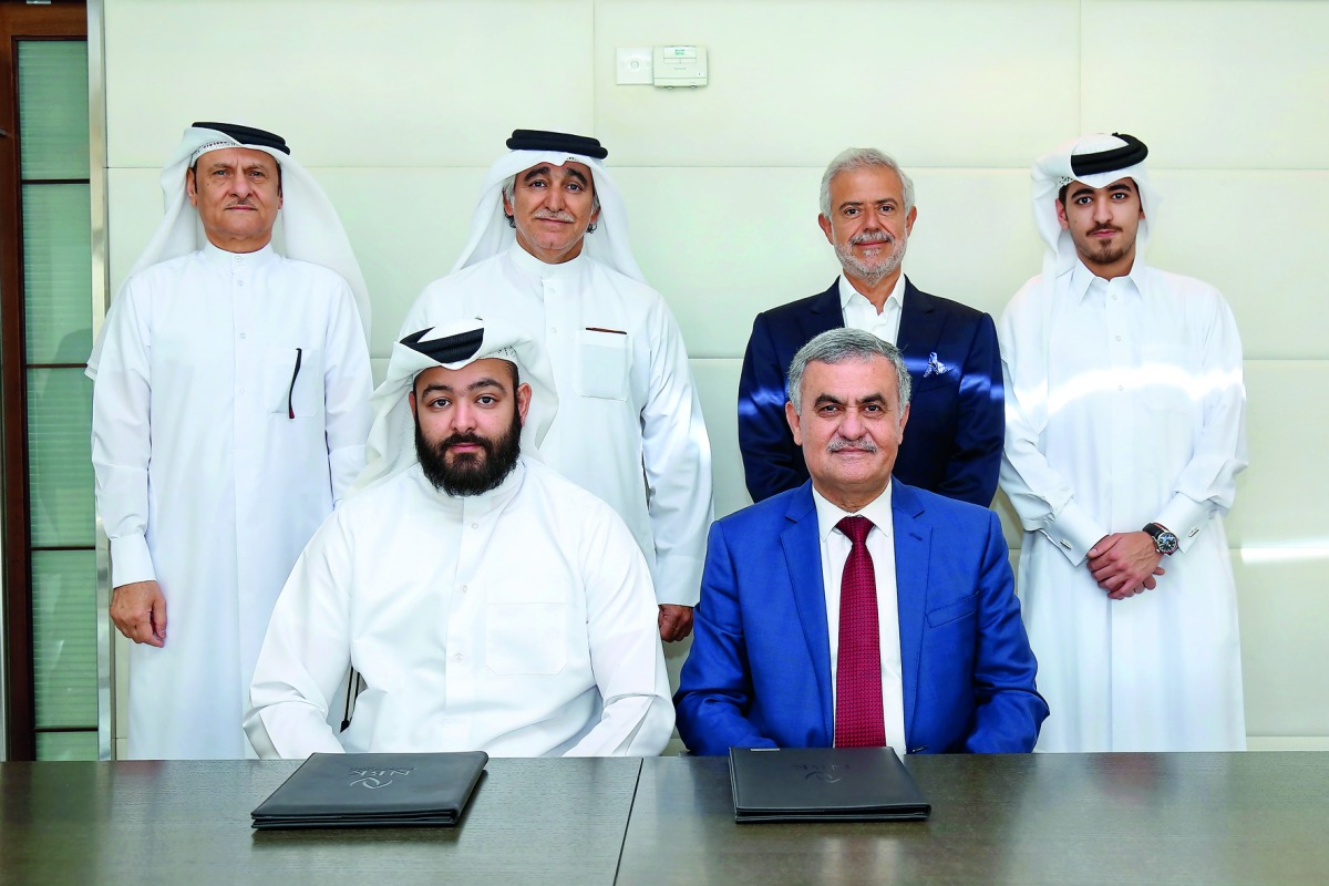 Officials of Al Wa’ab City and National Industrial Contracting Company.