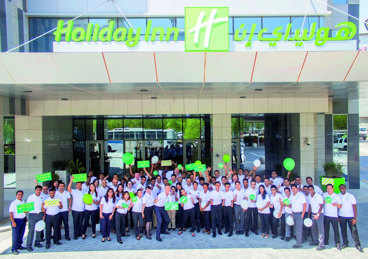 Employees at the opening of the Holiday Inn Doha — The Business Park.
