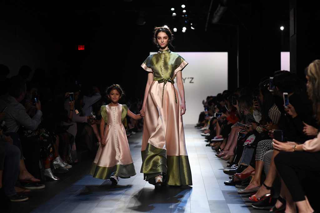 Models present creations by Vicky Zhang during the New York Fashion Week on September 13, 2017, in New York. AFP / Jewel Samad 