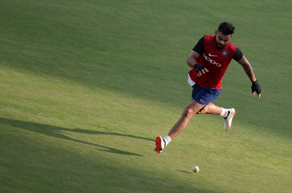 Indian Cricket Captain Virat Kohli runs during a training session ahead of the India-Australia cricket series in Chennai on September 15, 2017. (AFP / ARUN SANKAR)