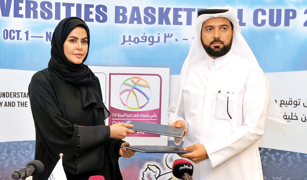 Hamad Bin Khalifa University’s (HBKU) Vice-President of Student Affairs Ms. Maryam Al Mannai (left) and Qatar Basketball Federation’s (QBF) Secretary-General Ali Al Malki exchanging the MoUs on enabling both parties to collaborate more closely on student 