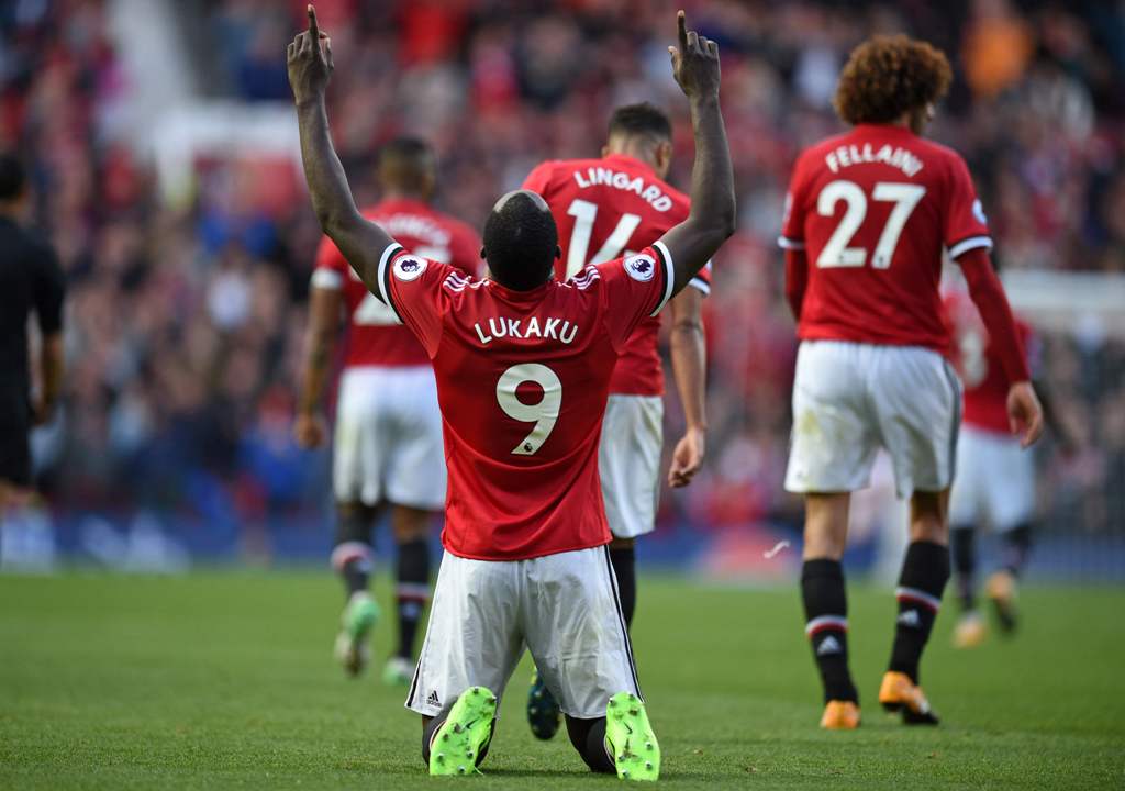 Manchester United's Belgian striker Romelu Lukaku celebrates after scoring their third goal during the English Premier League football match between Manchester United and Everton at Old Trafford in Manchester, north west England, on September 17, 2017.  /