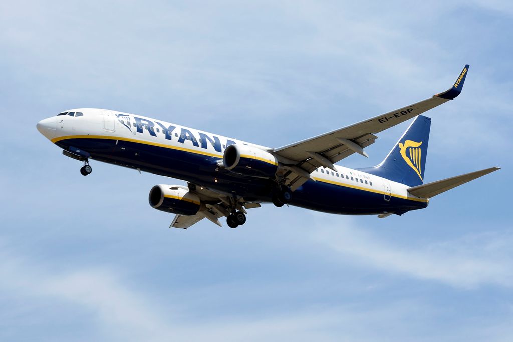 (FILES) This file photo taken on June 06, 2016 shows an airplane of the Irish low-cost airline Ryanair preparing to land at Barcelona's airport in El Prat de Llobregat.  AFP / JOSEP LAGO

