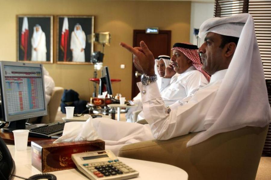 Traders monitor screens displaying stock information at Qatar Stock Exchange in Doha in this file photo (Reuters / Naseem Zeitoon) 