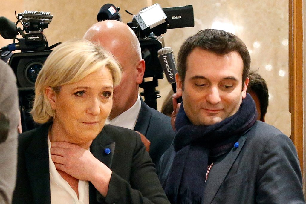 FILE PHOTO - Marine Le Pen (L), French National Front (FN) political party leader and then candidate for French 2017 presidential election, flanked by National Front (FN) party vice-president Florian Philippot (R), arrives to deliver a speech in Paris, Fr