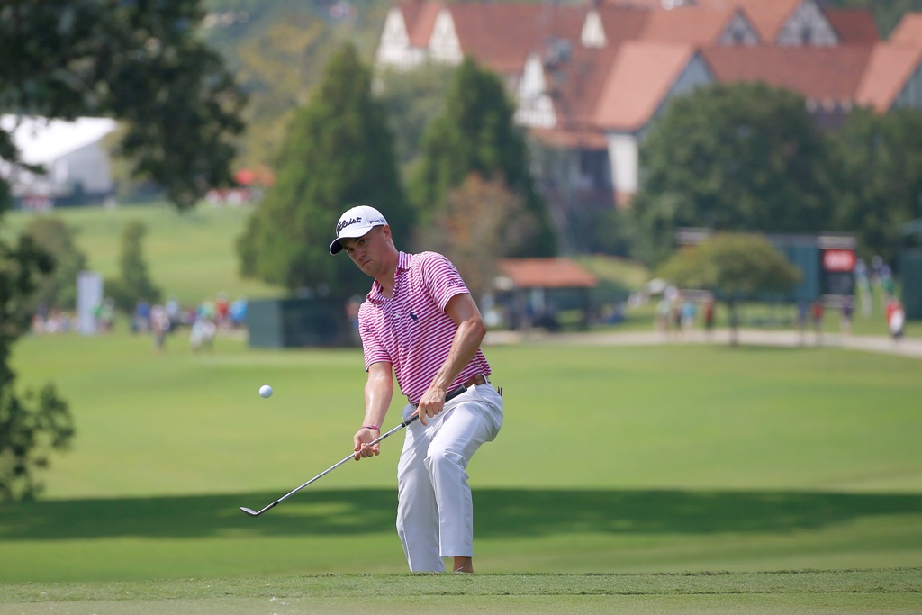 Justin Thomas chips up onto the 6th green during the second round of the Tour Championship golf tournament at East Lake Golf Club. Butch Dill
