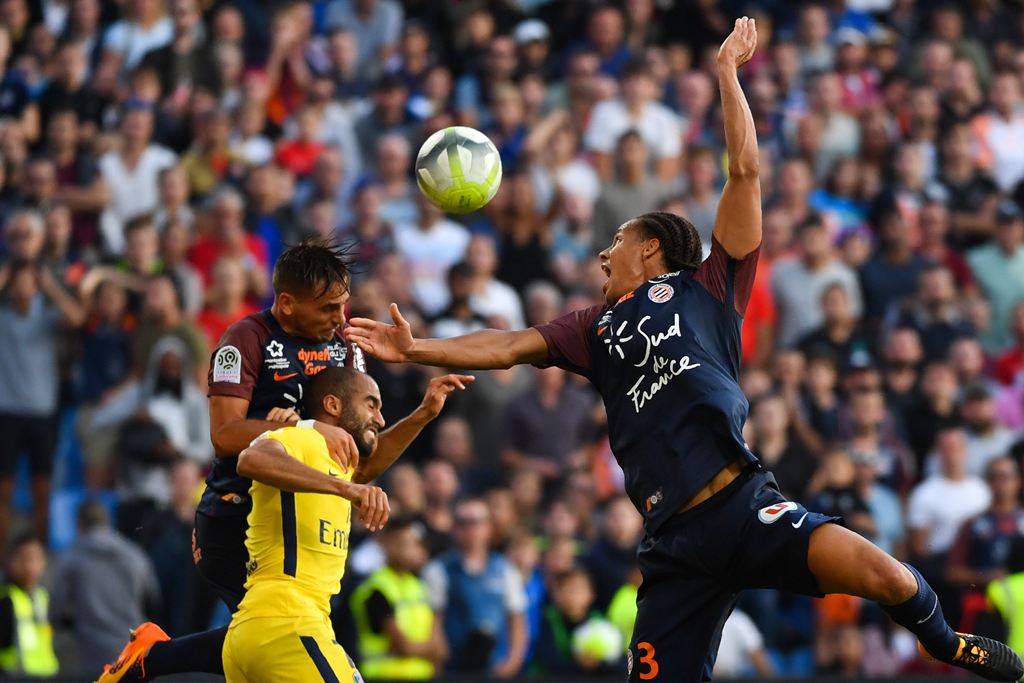 (From L) Montpellier's French defender Ruben Aguilar, Paris Saint-Germain's Brazilian forward Lucas and Montpellier's French defender Daniel Congr go for a header during the French Ligue 1 football match between Paris Saint-Germain (PSG) and Montpellier o