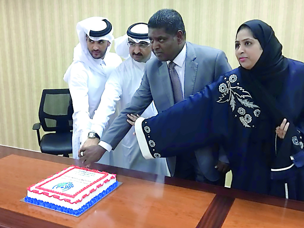 Centric Business Services executives cutting a cake to mark the opening of the firm.