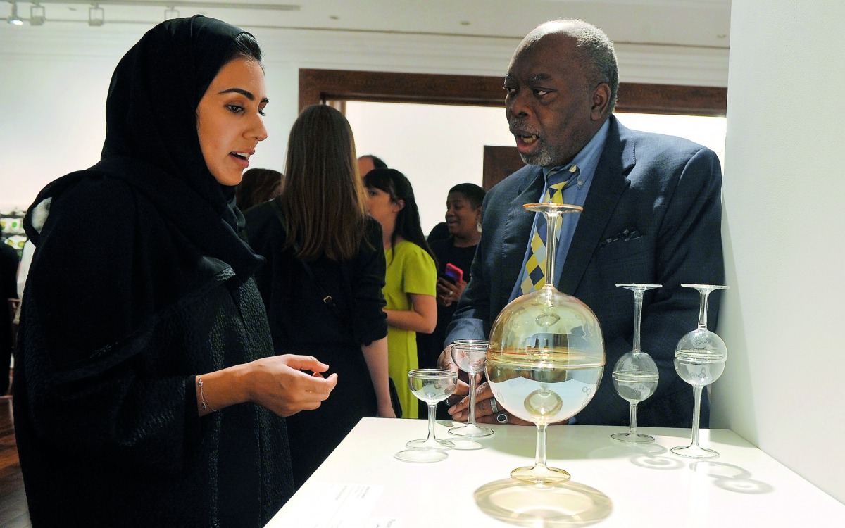 Dr. Akel I. Kahera, Dean of VCUarts Qatar, in discussion about the work ‘All ways giving Bowl’ by Aisha Al Sowaidi at the 20/20/20 exhibition held to celebrate the success of the campus. Pic: Kammutty VP / The Peninsula