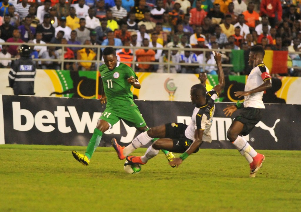 Samuel Sarfo of Ghana in action against Rabiu Ali of Nigeria during the Western African Football League final match between Ghana and Nigeria at the Cape Coast stadium in Ghana on September 24, 2017.

( Stringer - Anadolu Agency )
