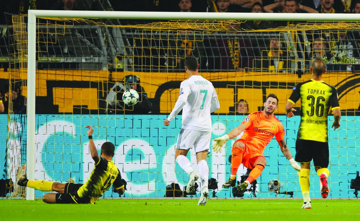 Real Madrid’s Cristiano Ronaldo scores the second goal against Borussia Dortmund during their UEFA Champions League match played at Westfalenstadion in Dortmund, Germany yesterday.