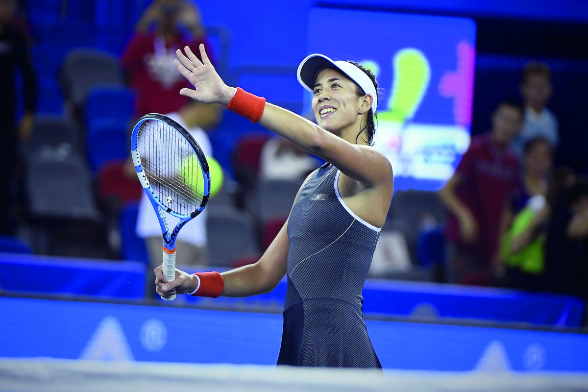 Garbine Muguruza of Spain celebrates after winning against Magda Linette of Poland during their third round women’s singles match at the WTA Wuhan Open in Wuhan, in China’s central Hubei province, yesterday.
