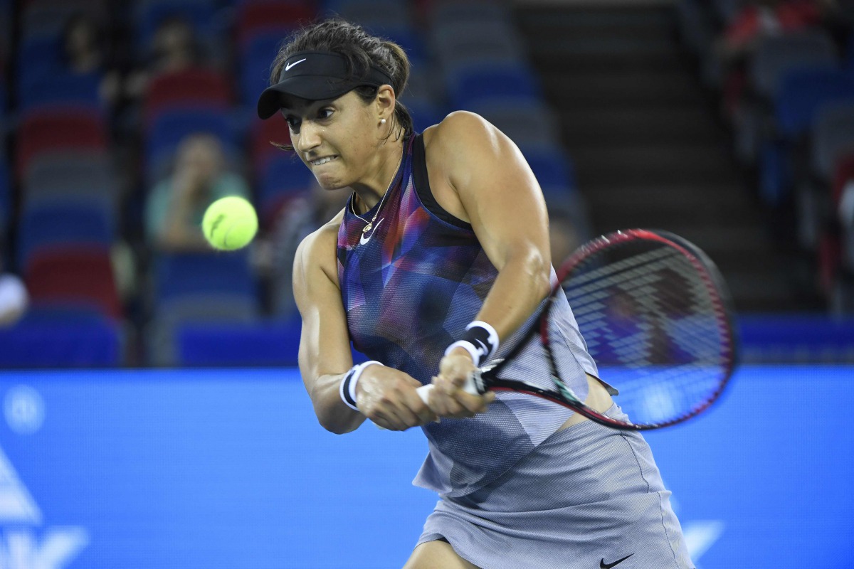 Caroline Garcia of France hits a return against Ekaterina Makarova of Russia during their women's singles quarter-final match at the WTA Wuhan Open tennis tournament in Wuhan, in China's central Hubei province on September 28, 2017. AFP / Wang Zhao