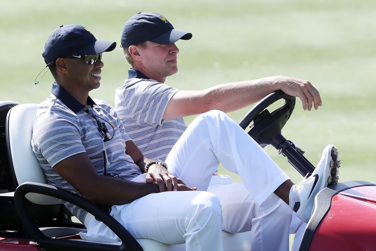 Captain's assistant Tiger Woods of the U.S. Team and Captain Steve Stricker of the U.S. Team ride in a cart during practice rounds prior to the Presidents Cup at Liberty National Golf Club on September 27, 2017 in Jersey City, New Jersey. Sam Greenwood/Ge