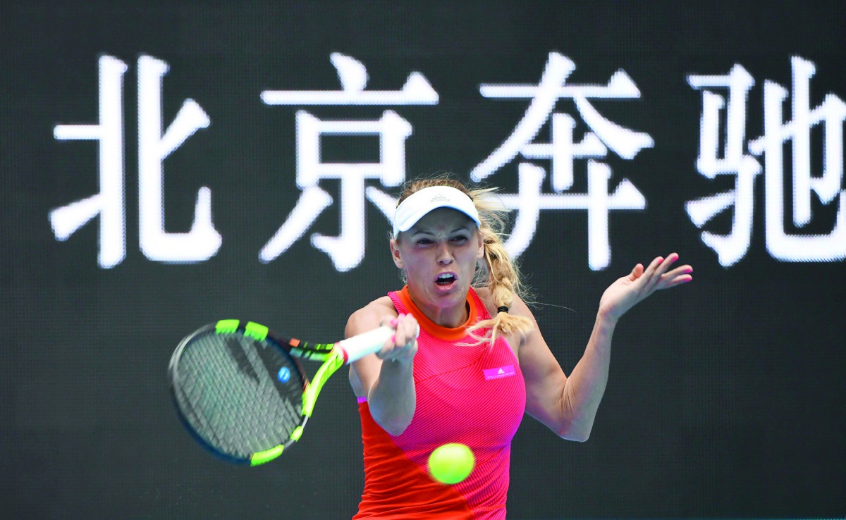 Caroline Wozniacki of Denmark hits a return during her women’s singles match against Wang Qiang of China at the China Open in Beijing yesterday. 