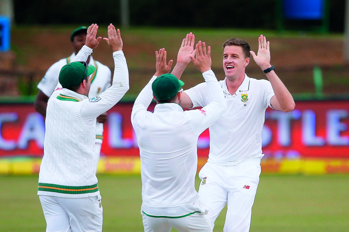 South African bowler Morne Morkel (left) celebrates the dismissal of Bangladeshi batsman Mominul Haque (not in picture) during the fourth day of the first Test match against Bangladesh, yesterday.