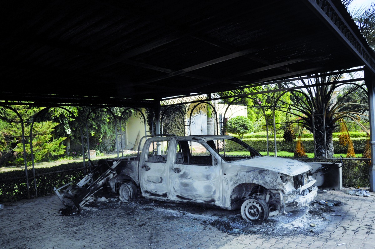 A file picture of a burnt car in a building at the US Consulate in Benghazi, Libya.