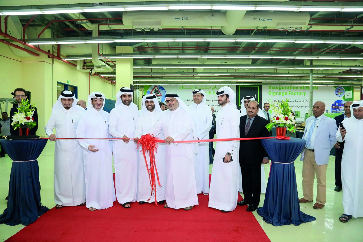 Ashghal President Dr Saad bin Ahmed bin Ibrahim Al Mohannadi; Abdul Aziz bin Nasser Al Khalifa, the Chairman of Elan Group and CEO of Qatar Development Bank, and Jaber Abdullah Al Ansari, Elan Group CEO, inaugurating the Elan Signage factory in the Indust