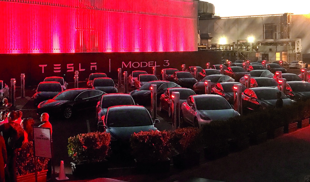 Tesla Model 3 cars wait for their new owners as they come off the Fremont factory’s production line during an event at the company’s facilities in Fremont, California.