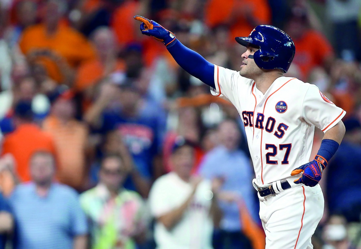 Houston Astros second baseman Jose Altuve hits a solo home run during the seventh inning against the Boston Red Sox in game one of the 2017 ALDS play-off baseball series at Minute Maid Park on Thursday.