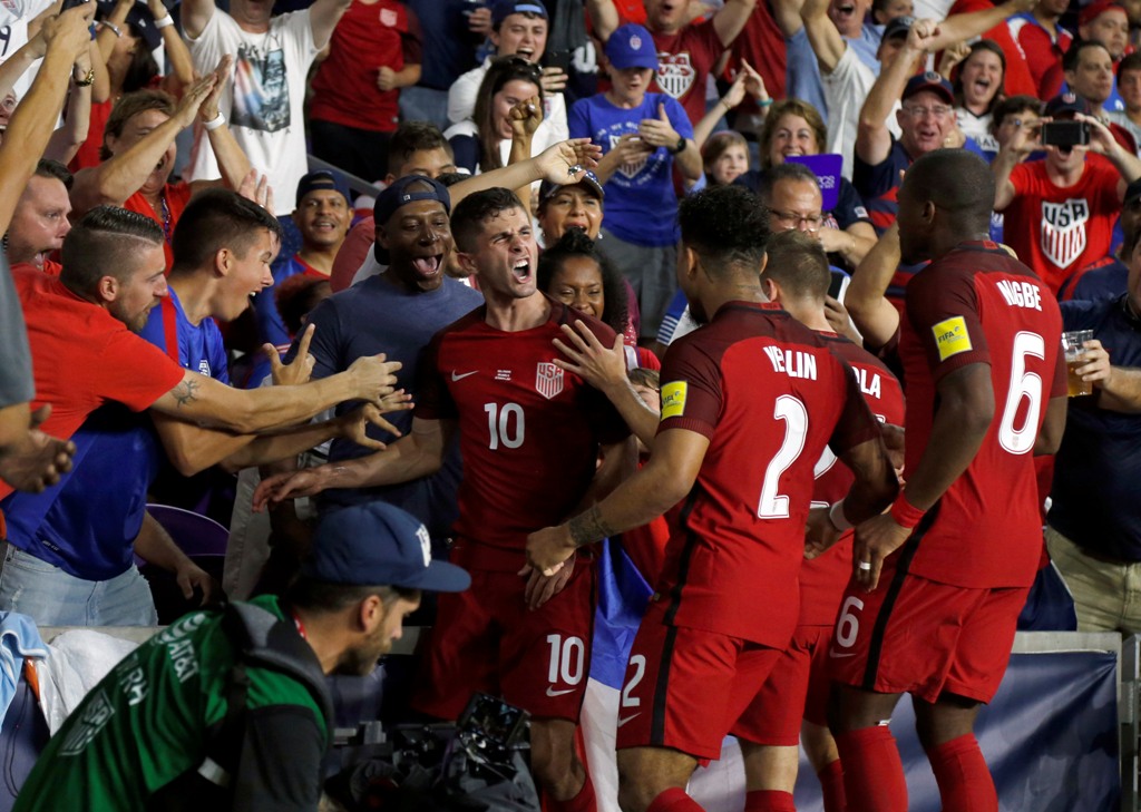 USA midfielder Christian Polisic (10) celebrates with teammates as he scores a goal against the Panama during the first half at Orlando City Stadium. Mandatory Credit: Kim Klement
