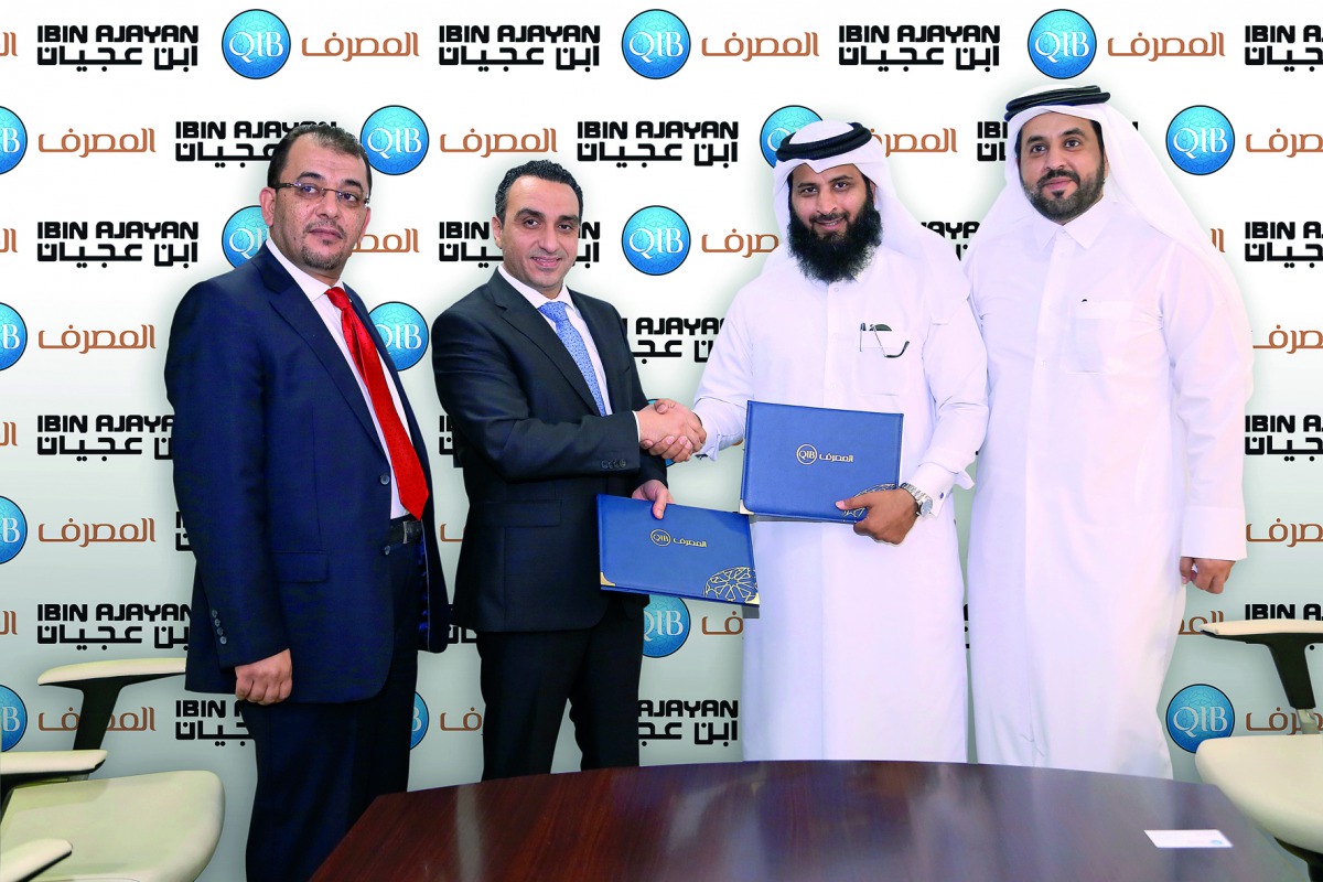 Senior executives from both organisations seen shaking hands over signed agreement.