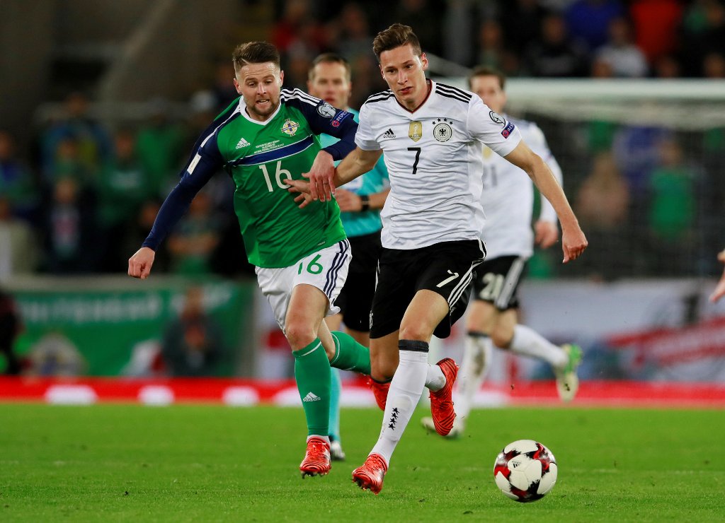 Germany’s Julian Draxler in action with Northern Ireland’s Oliver Norwood Action Images via Reuters/Jason Cairnduff
