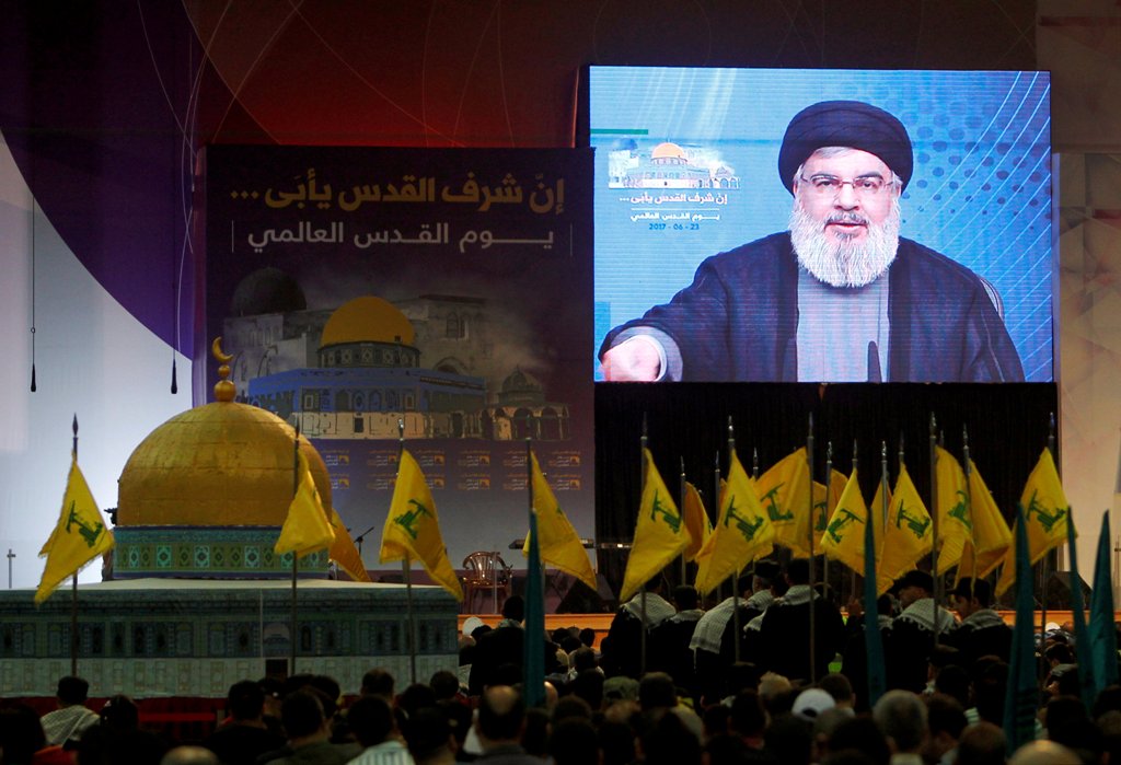 Lebanon's Hezbollah leader Sayyed Hassan Nasrallah addresses his supporters via a screen during a rally marking Al-Quds day in Beirut's southern suburbs, Lebanon June 23, 2017. REUTERS/Aziz Taher/File Photo
