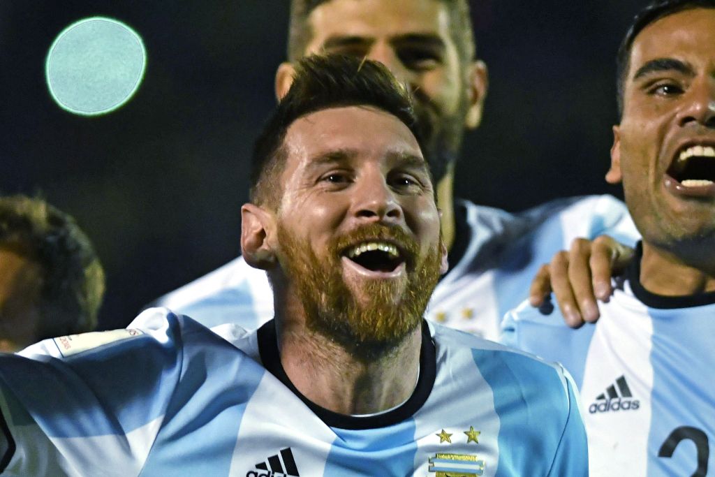 Argentina's Lionel Messi celebrates after defeating Ecuador and qualifying to the 2018 World Cup football tournament, in Quito, on October 10, 2017. / AFP / Juan Ruiz