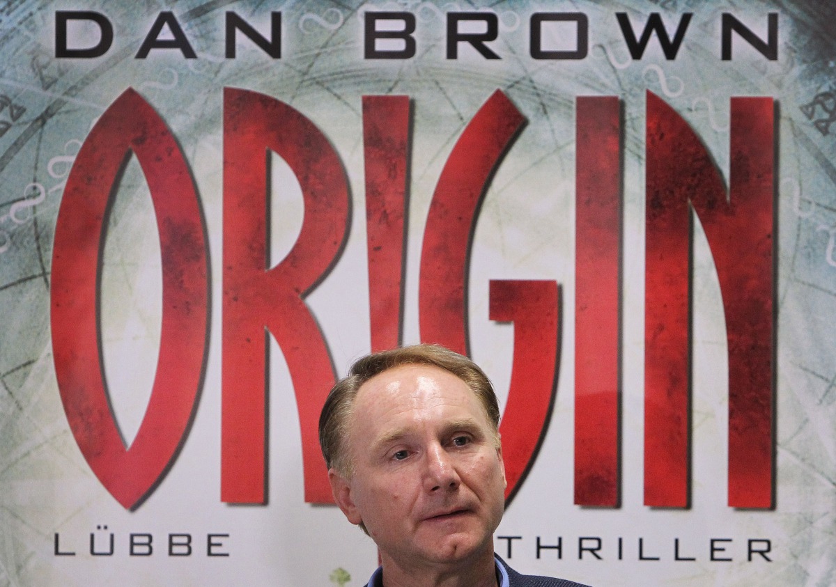 US author Dan Brown poses in front of a poster promoting his new book 