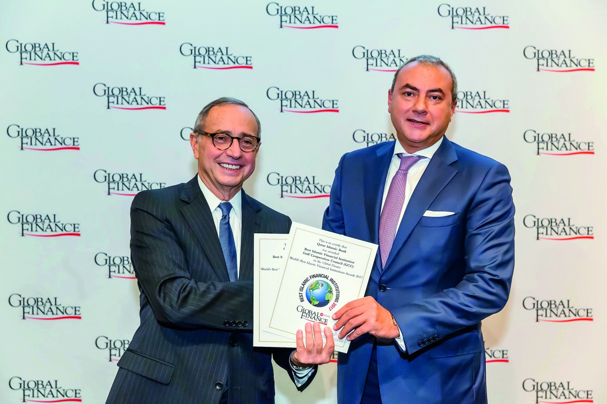 QIB Group CEO Bassel Gamal (right) receiving the Global Finance Award in Washington DC.