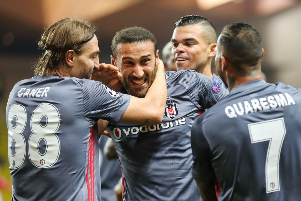 Besiktas' forward Cenk Tosun (2ndL) celebrates with Besiktas' defender Caner Erkin (L), Besiktas' Portuguese defender Pepe (2ndR) and Besiktas' Portuguese midfielder Ricardo Quaresma after scoring his second goal during the UEFA Champions League group sta