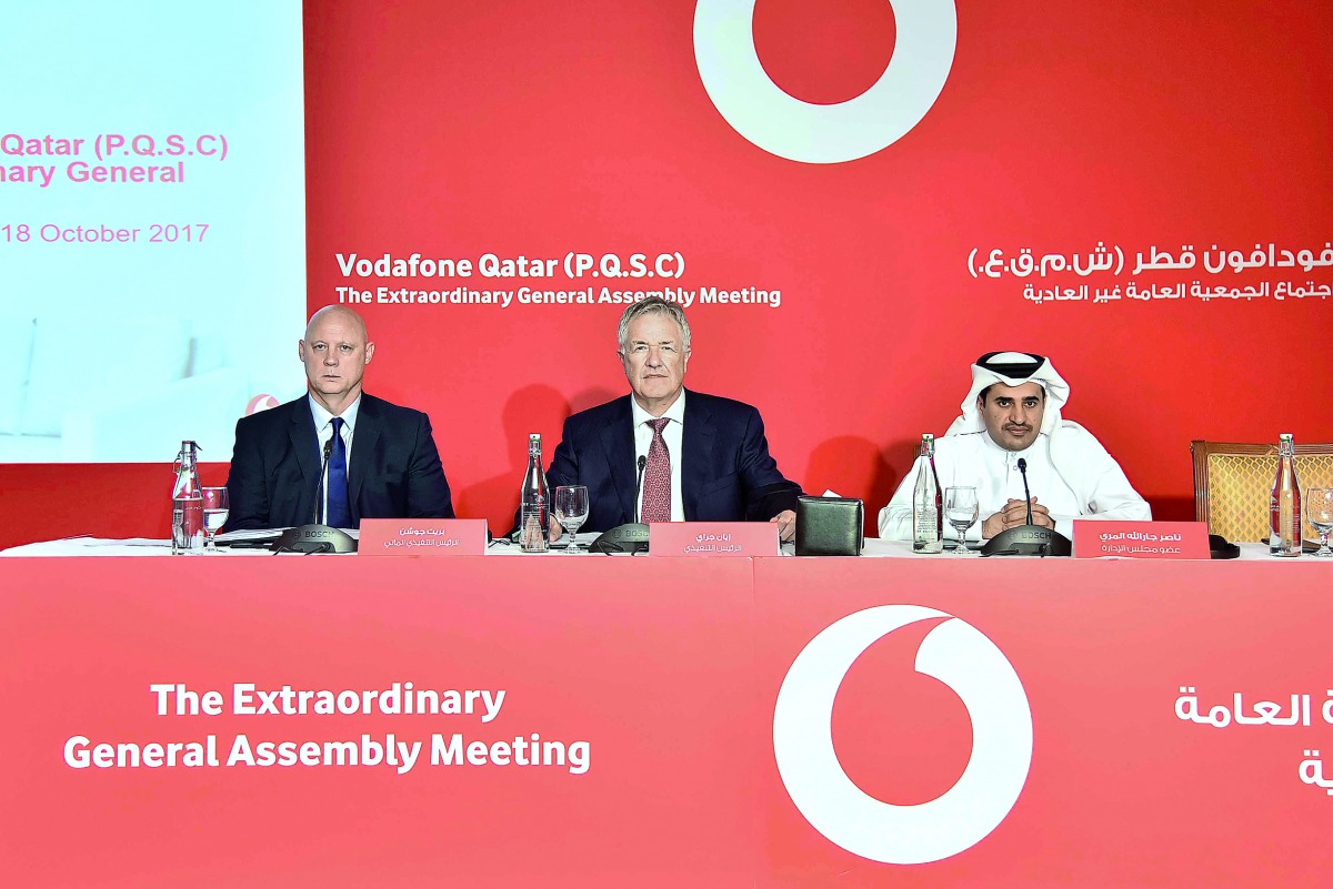 Vodafone Qatar’s CEO, Ian Gray (centre), Board Member, Nasser Al Marri (right), and CFO, Brett Goschen, at the company’s EGA meeting in Doha, yesterday.  
