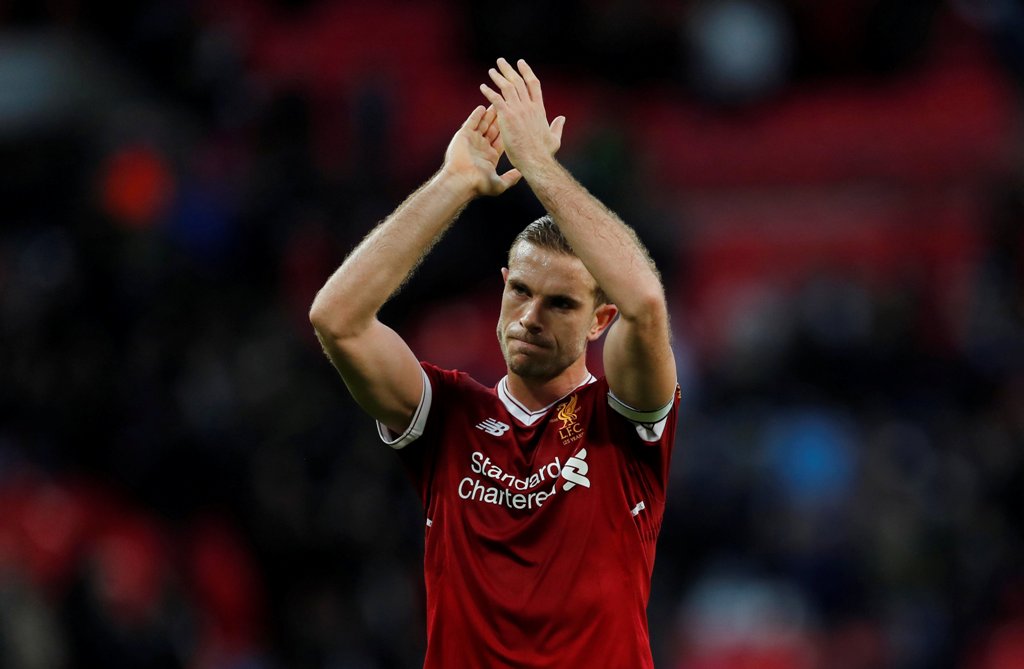 Liverpool's Jordan Henderson applauds fans after the match REUTERS/Eddie Keogh